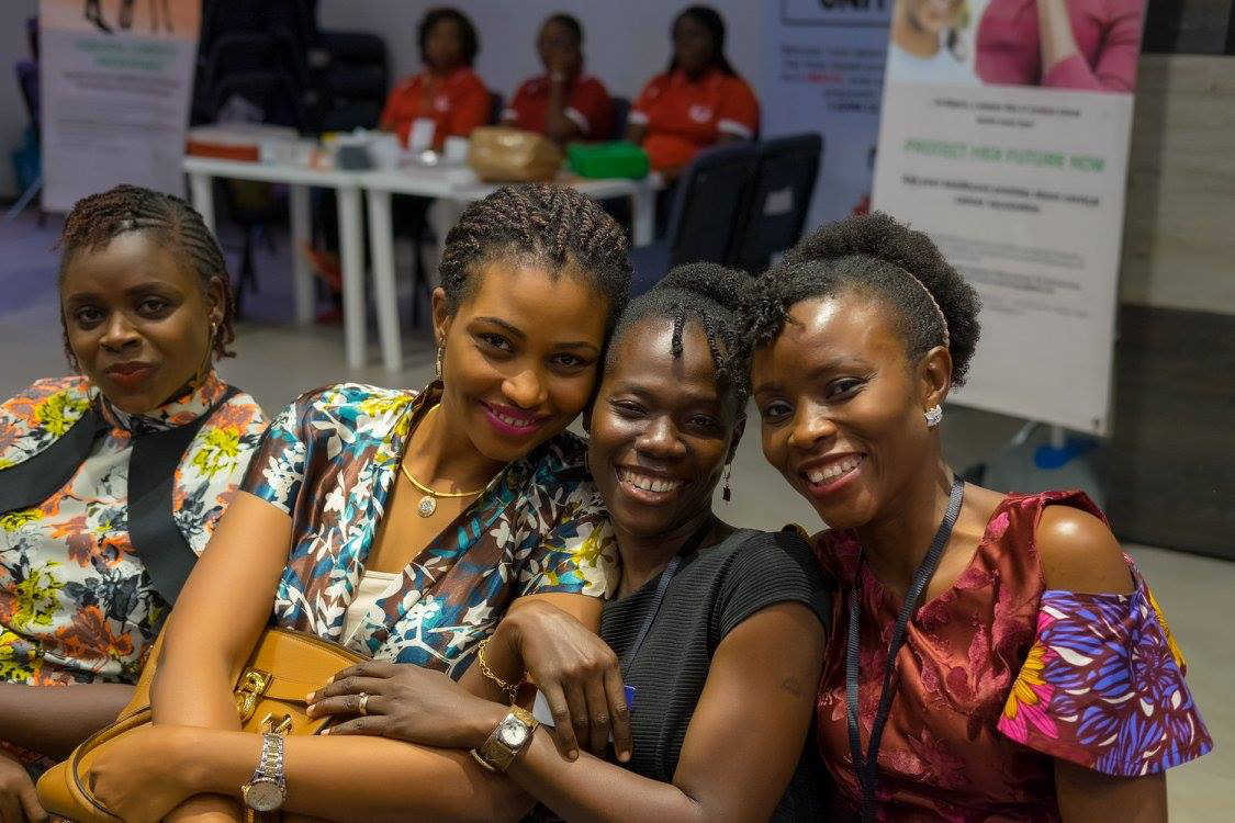 Four women smiling together at a Jewels community gathering